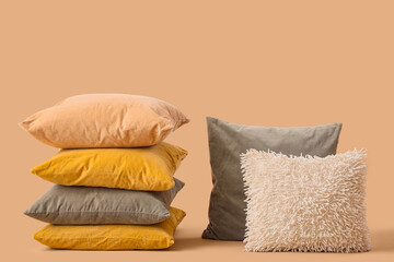 Different pillows on beige background