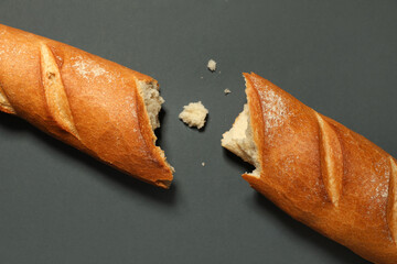 Fresh baguette on black background