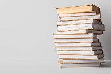 Stack of books on grey background