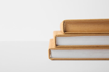 Stack of books on grey background