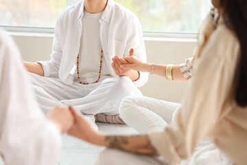 Group of people meditating in circle