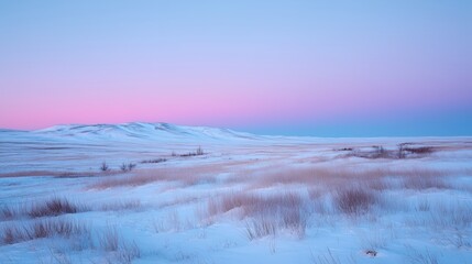 Obraz premium Beautiful winter landscape at dusk with soft pastel colors over snow-covered hills