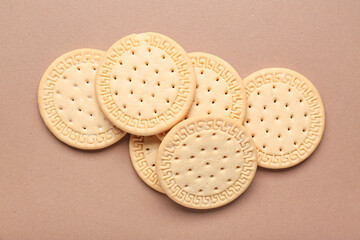 Many sweet cookies on brown background