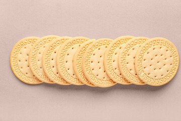 Many sweet cookies on beige background