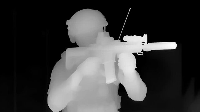  Infrared night vision thermal view of a tactical soldier in combat gear aiming a rifle indoors during a covert operation.