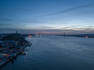 Power Outage in Lisbon. Dark City, 25th of April Suspension Bridge and Tagus River at Evening...