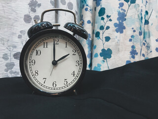 An alarm clock showing the time