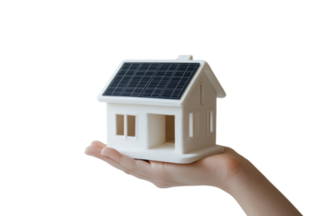 Hand holding a model house with solar panels.