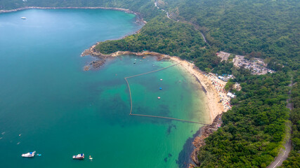 May 1 2025 Secluded Beach with Boats and Dense Forest Surrounding