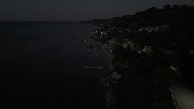 Drone flies along coast north of Punta Gorda in the early evening in Roat&aacute;n, Honduras