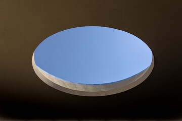 large skylight in modern concrete building minimalist minimal photo photography (blue sky portal port hole style brutalist postmodern) sunlight roof circle round oval holes