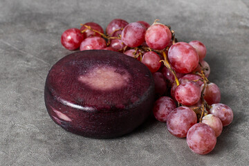 bunch of red grapes with cheese