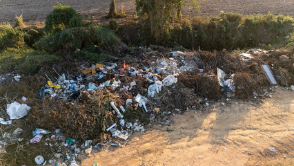 Garbage field (or Landfill) in rural Thailand. It provides a specific place for the disposal of garbage.