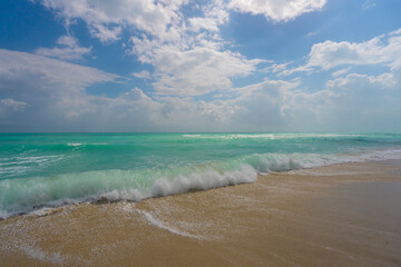 Ocean wave motion on sea shore. Summer sea breeze. Sea nature backdrop. Peaceful ocean. Dreamy ocean horizon. Coastal ocean paradise wallpaper. Seafoam waves. Azure water surface. Golden hour beach.