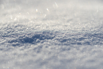 Snow covers the background. Snow shows the beauty of winter. Snow looks bright and white. Snow stays frozen all day. Snowy pattern. Snowflake falls. Cold and icy background.