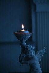 burning candle in a candlestick