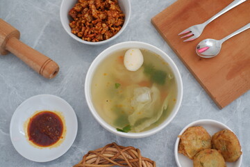 a traditional Indonesian meal served in a clean and appealing setting
