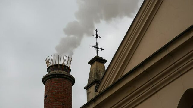 White smoke rises from the chapel chimney, indicating the successful election of a new pope during the papal conclave, smoke from chimney,incense sticks in a temple, 4k video
