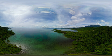 Obraz premium The coast with the jungle and the view of the islands. Borneo, Sabah, Malaysia. Virtual Reality 360.