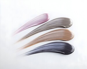 Four shades of cosmetic cream are swirled onto a white background showcasing their texture and color variations