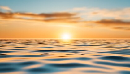 Obraz premium Serene sunset over calm ocean waters golden hues paint the sky and sea
