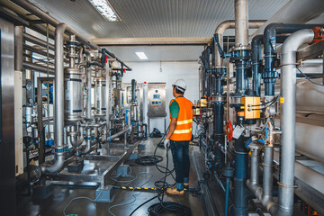 Male worker install is using Industrial electrician engineer tests electrical box