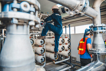 Male worker install is using Industrial oxygen tanks in chemical factory. Oxygen storage vessels, which is either held under pressure in gas cylinders, or as liquid oxygen