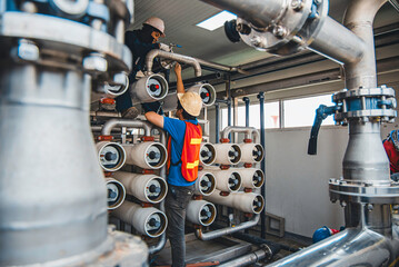 Male worker install is using Industrial oxygen tanks in chemical factory. Oxygen storage vessels, which is either held under pressure in gas cylinders, or as liquid oxygen