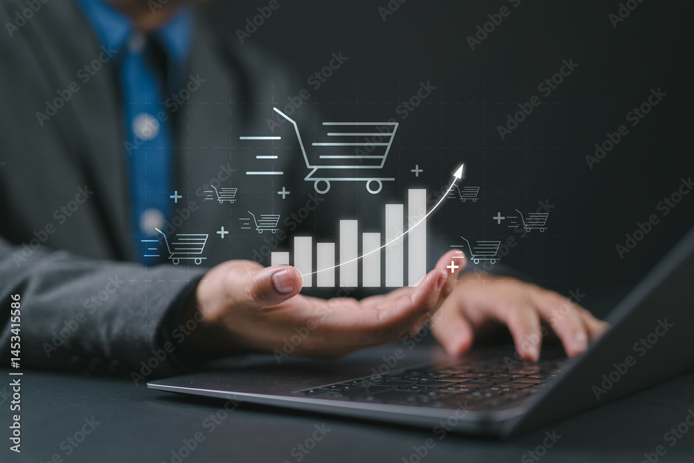 Aufkleber Sale growth concept. Businessman using laptop with graph of increase in sales volume with shopping cart on virtual screen for ecommerce growth.