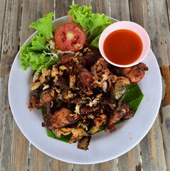 Fried frog salad with meat