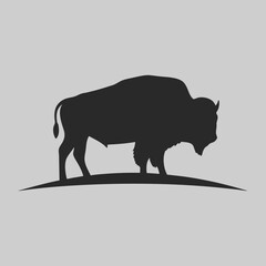 Majestic American Bison Silhouette on Grey Background a powerful symbol of the American West in elegant black vector art