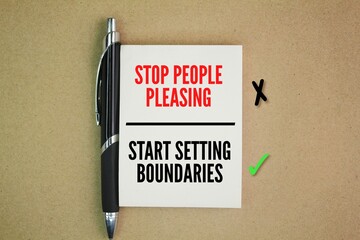pens and books with the words STOP PEOPLE PLEASING - START SETTING BOUNDARIES