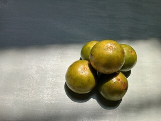 Fresh Green Oranges Piled Together