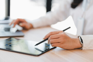 Businesswoman hand digital tablet stylus technology office workspace touchscreen graph data analysis modern professional working closeup female business document chart creative planning desk
