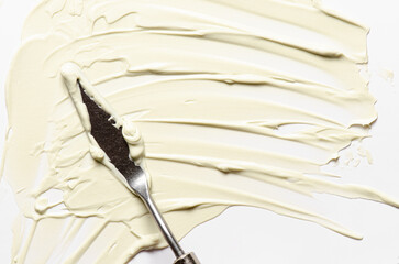 The texture of cosmetic moisturizer with palette knife
