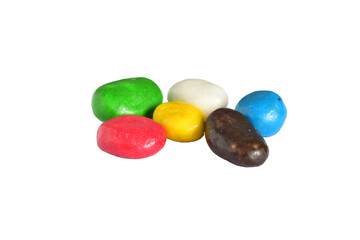 Different shades of dragee candies with filling lie on a white background.