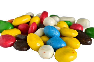 Various shades of dragee candies with filling lie on a PNG background.