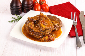 Italian cuisine - ossobuco with sauce