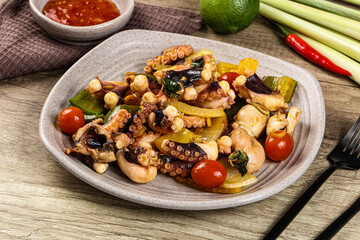 Roasted octopus with vegetables and oil