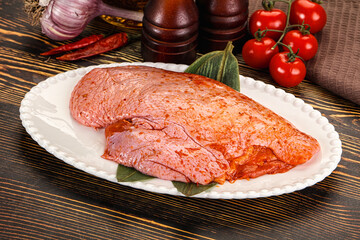 Raw marinated duck breast for cooking
