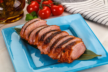 Sliced duck breast baked with cherry
