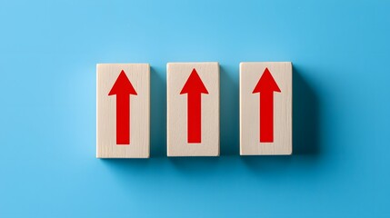 Fototapeta premium Three Wooden Blocks with Red Up Arrows Growth Progress Success Concept