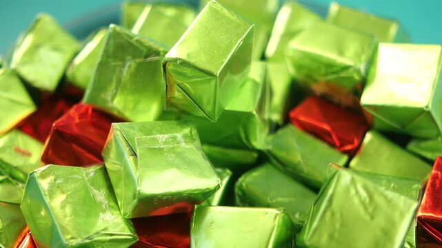 Colorful wrapped candies in a festive arrangement on a plate