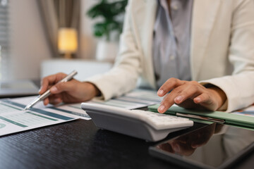 working in the office with a lot of paper work, businessman is checking marketing data, e an employee is working with finance document, sitting in the office working for accountant company