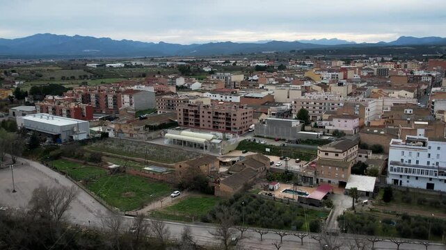 Mora de Ebro aerial view with village, river, and bridge in Catalonia, Spain. High quality 4k footage