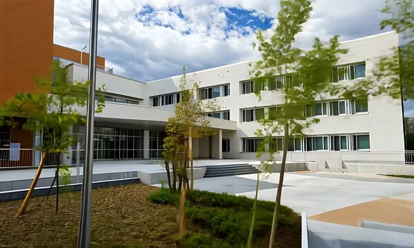 Modern School Building Exterior with Orange and White Facade