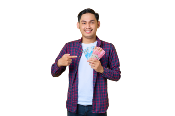 Smiling young Asian man in plaid shirt pointing at money banknotes isolated on transparent background