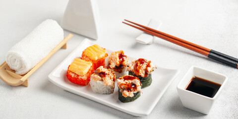 Japanese food sushi roll set with soy sauce on the table