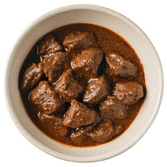 A bowl of mutton beef curry, a traditional Indian dish made with marinated and sautéed meat in a rich red sauce