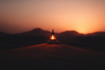 Desert lamp illuminates a serene sunset, casting a warm glow on the sand dunes